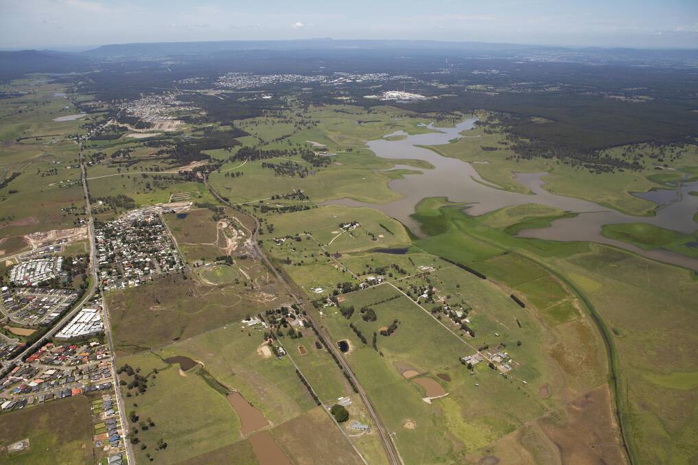 AERIAL VIEW: Looking south-west to the smelter with environmental wetlands to the right, and land to be developed for housing between Gillieston Heights in the foreground, and Heddon Greta, closer to the smelter. 