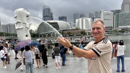 Daniel Scott at Merlion Statue Singapore, the fish-like body and lions head symbolises the countrys resilience. Picture by Daniel Scott