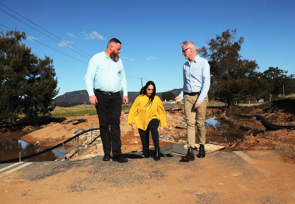 Federal Labor MP for the Hunter Dan Repacholi, Broke Residents Community Association volunteer , Angela Andonopoulos and Special envoy for Disaster Recovery, Senator Tony Sheldon. Picture: Peter Lorimer