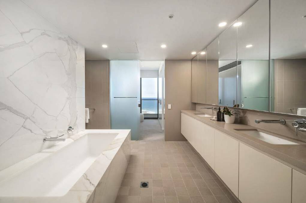 The luxury ensuite has a twin vanity and bath tub. Picture supplied
