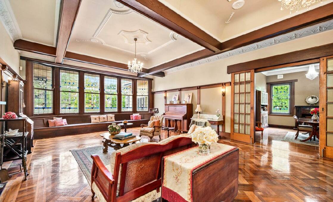 The formal living room is grand in size and appearance with leadlight windows, coffered ceiliings and parquetry flooring. Picture supplied