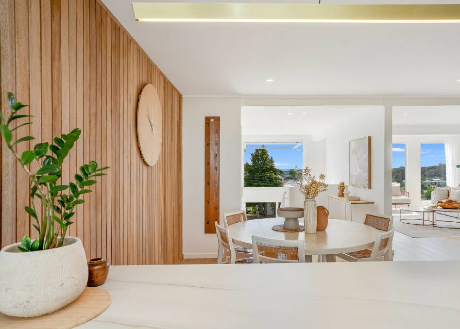 The original timber wall panels are a feature in the dining room. Picture supplied