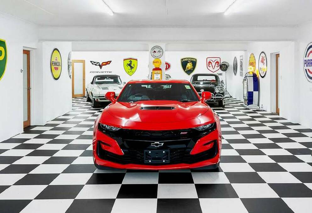 The photos from the listing in 2020 displayed a collection of luxury cars in the 14-car garage at 7 Foreshore Street, Eraring. Picture supplied