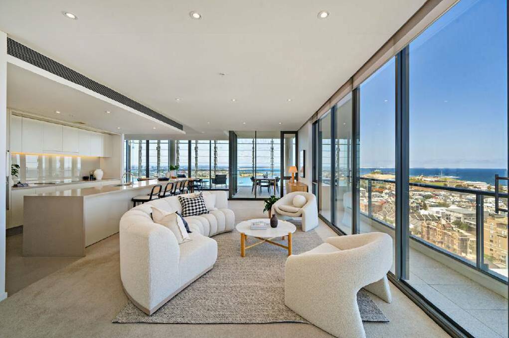 The open-plan kitchen and living area takes in views across the beaches, the harbour and beyond. Picture supplied
