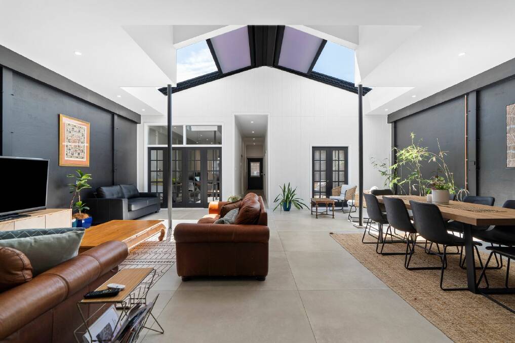 The retractable roof in the living area allows natural light to flow in to the space. Picture supplied