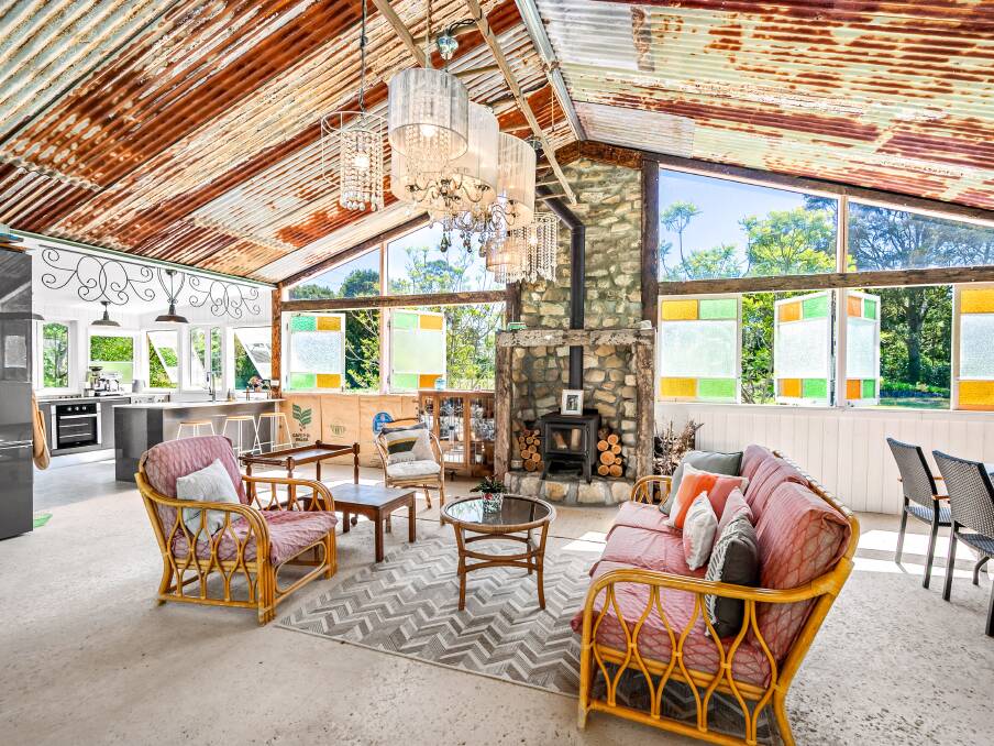 The 'summer house' was built using recycled windows including an old tin roof lining, rustic chandeliers and hessian coffee bags. Picture supplied