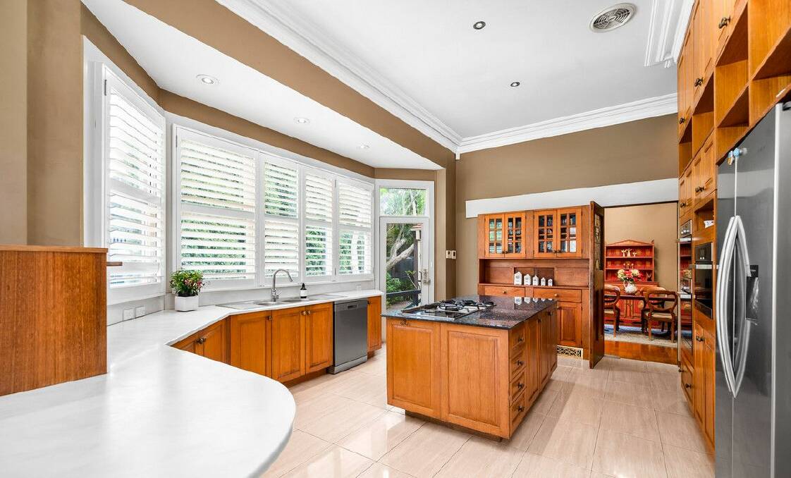 The kitchen has an island bench, three ovens and a walk-in pantry. Picture supplied