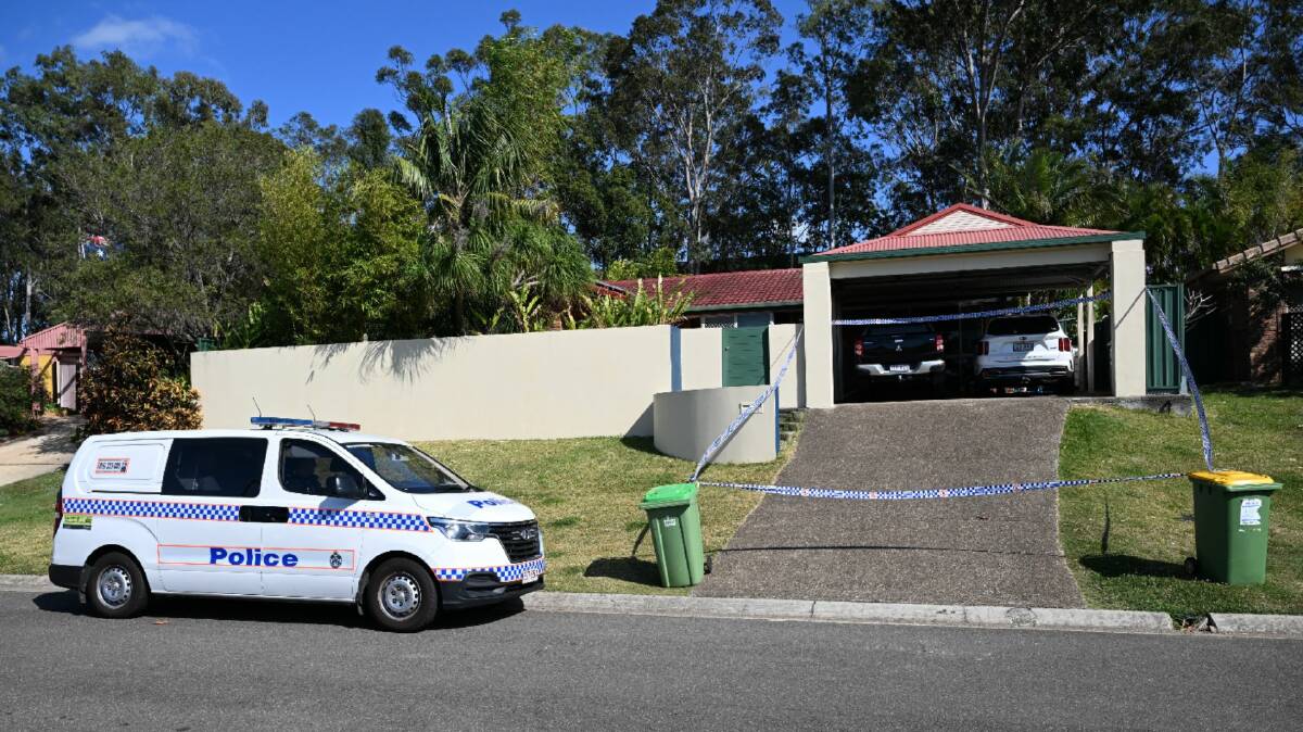 Police are seen at a murder scene in the suburb of Arundel, Gold Coast, Thursday, August 24, 2023. Queensland police have charged a Gold Coast city councillor with murder following the death of a 58-year-old man at Arundel. (AAP Image/Darren England)