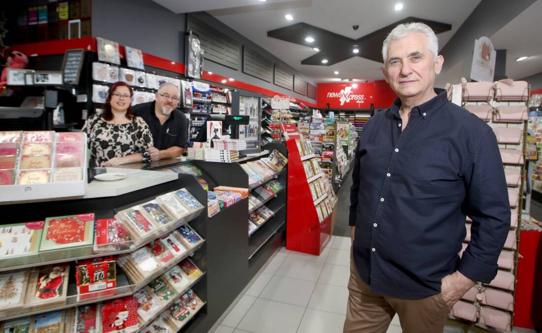 Danny Gugucevski handing over the reins of NewsXpress Dapto Mall to new owners Ian Hutchison and Leonie Robinson. Picture by Sylvia Liber.