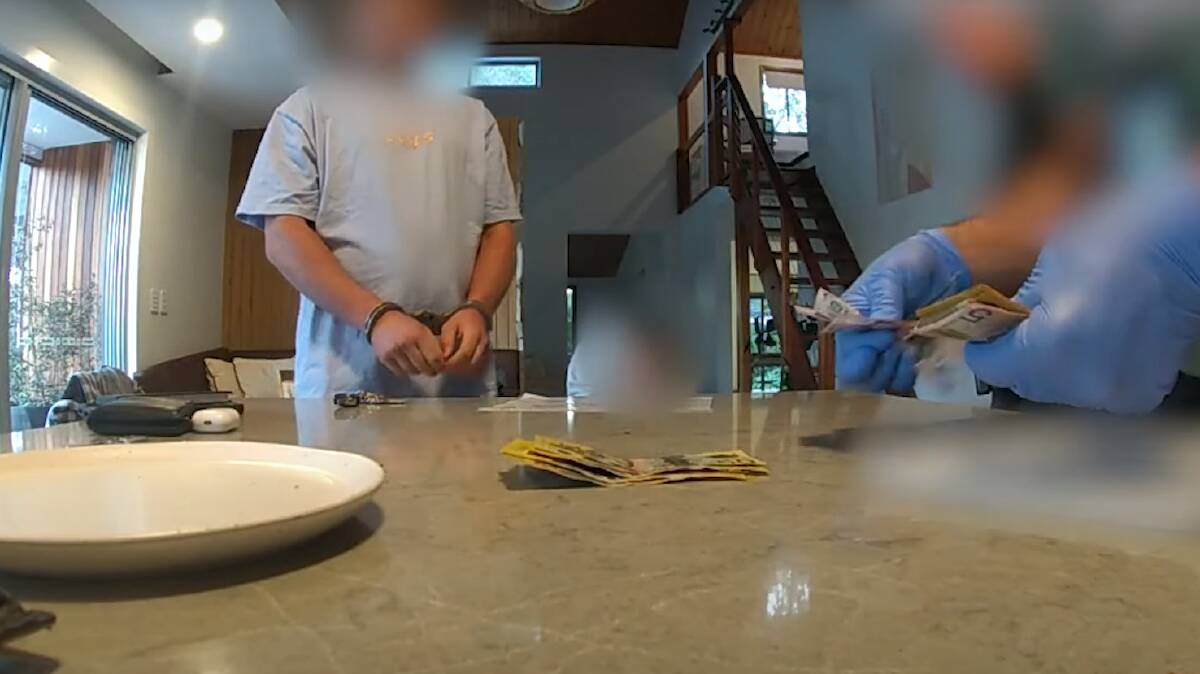 Still from footage of raids on a Currumbin Valley home and alleged MDMA lab. Picture via QLD Police