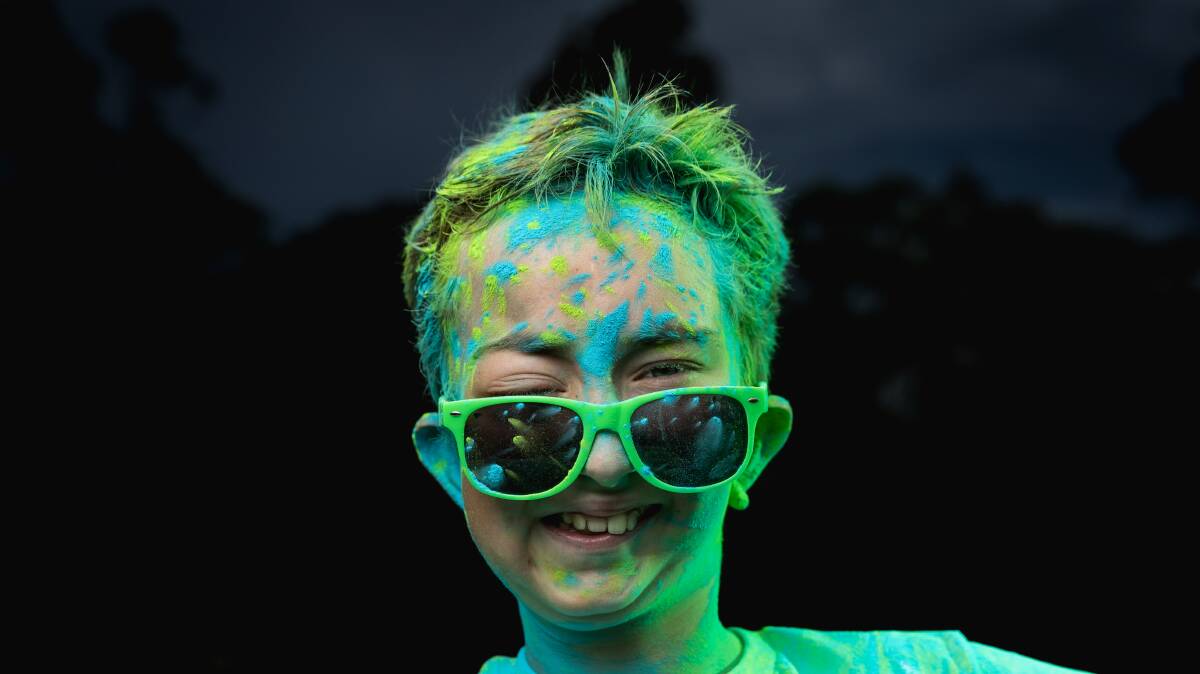 Tom Smith covered in green and blue chalk, the colours of the Children's Tumour Foundation. Picture by Marina Neil