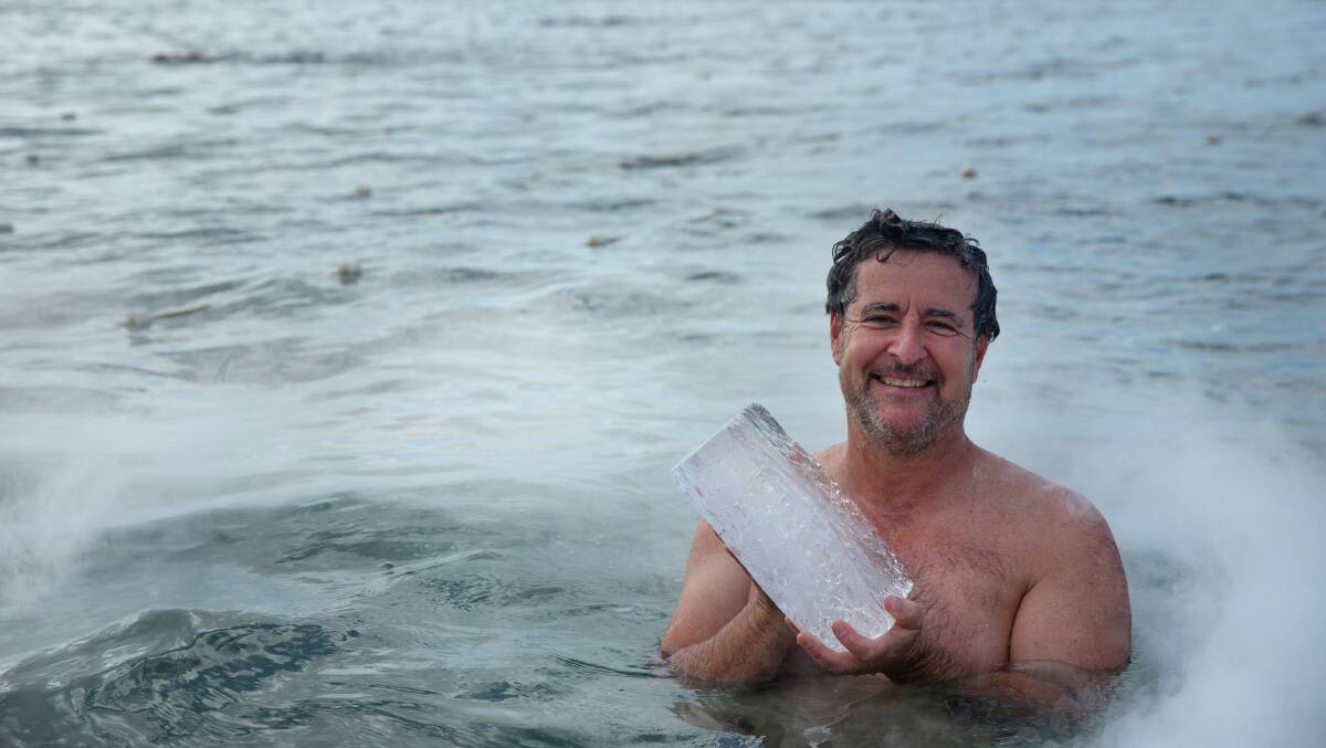 President Steven Weller 'christening' the baths with an ice brick last year. Photo by Marin Neill