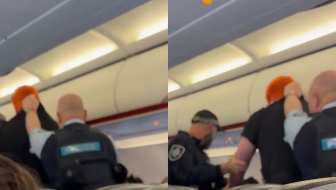 AFP officers remove the man from the Jetstar flight at Sydney Airport. Pictures by queen_of_australia via TikTok