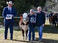 Grand champion female Sugarloaf Jewell U174, with cattle judge Scott Myers, The Rock, Mackinley Klippel, 11, Towong, Vic and Olivia Pearce, Herefords Australia. 