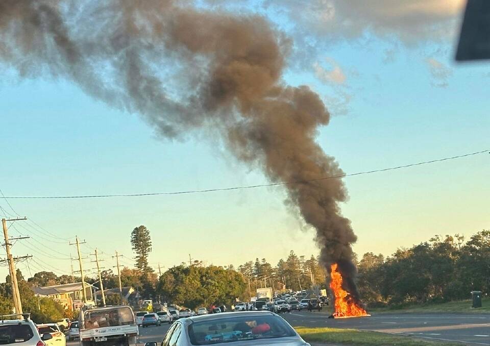 A motorcycle was on fire following a crash on Nelson Bay Road in Fern Bay. Picture supplied
