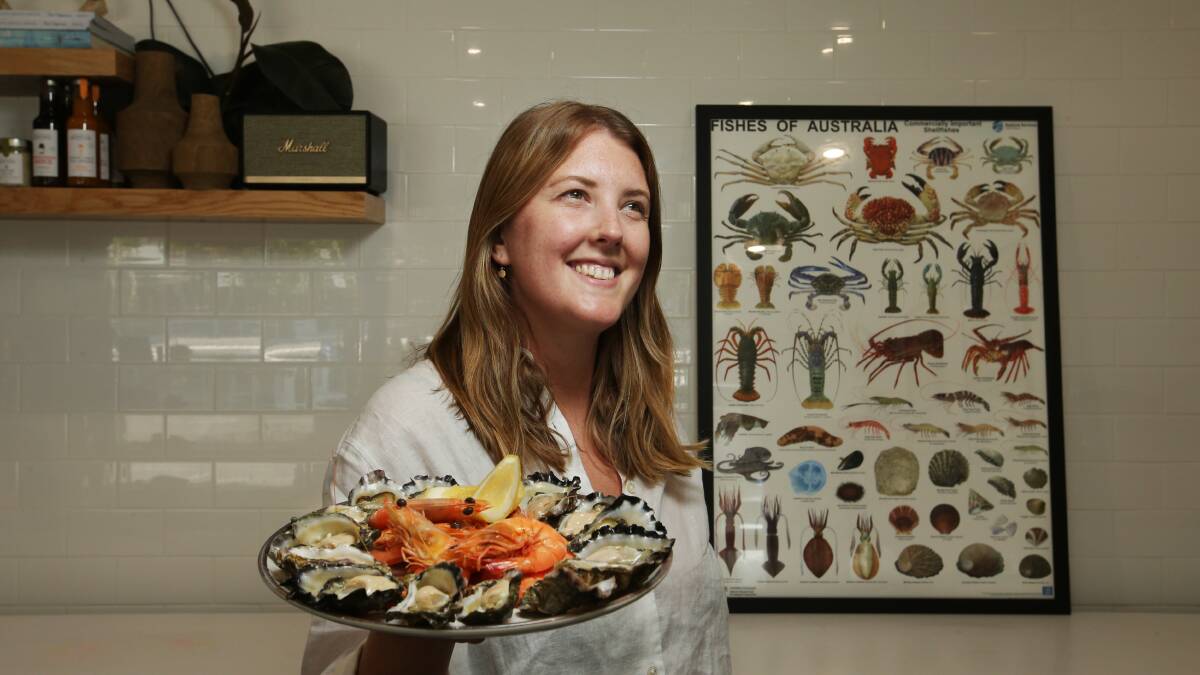 Dawson's Oysters manager Hannah Woods with a sample of the store's prawn and oyster offerings. Picture by Simone De Peak