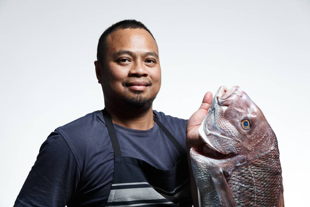 Chef Emerson Rodriguez with fresh snapper, indicative of his seafood favourites. Picture by Max Mason-Hubers