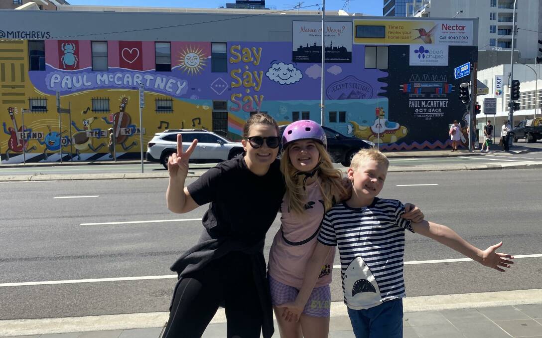 Jade Lazarevic with her children Lyla and Will in front of the new McCartney mural. "I'm taking my kids to see Paul with me, and it truly is a dream come true," she says.