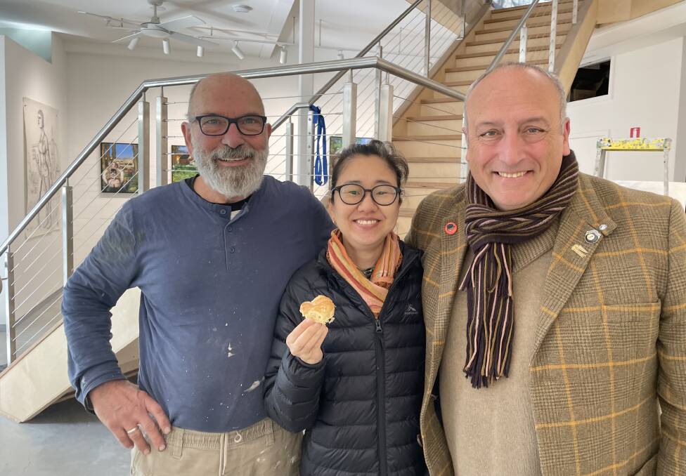 Straitjacket gallery founders Dino Consalvo and Ahn Wells with artist Mario Minichiello in the gallery today ahead of the opening of Homeward Bound on Saturday. Picture by Jim Kellar