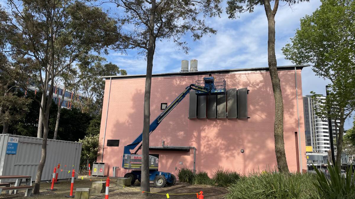 Just the beginning of the mural on Newcastle Art School TAFE on Hunter Street by Damien Mitchell. Picture by Jim Kellar