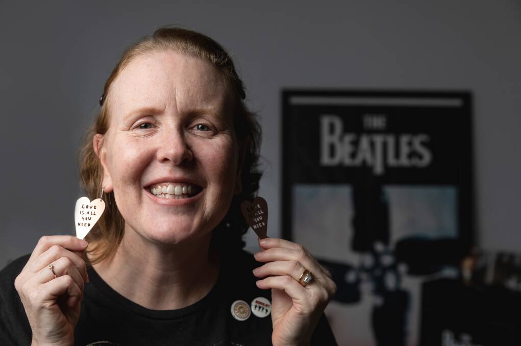 Newcastle Paul McCartney fan Judith Whitfield shows her 'Love Is All You Need' earrings among her many souvenir treasures. Picture by Marina Neil