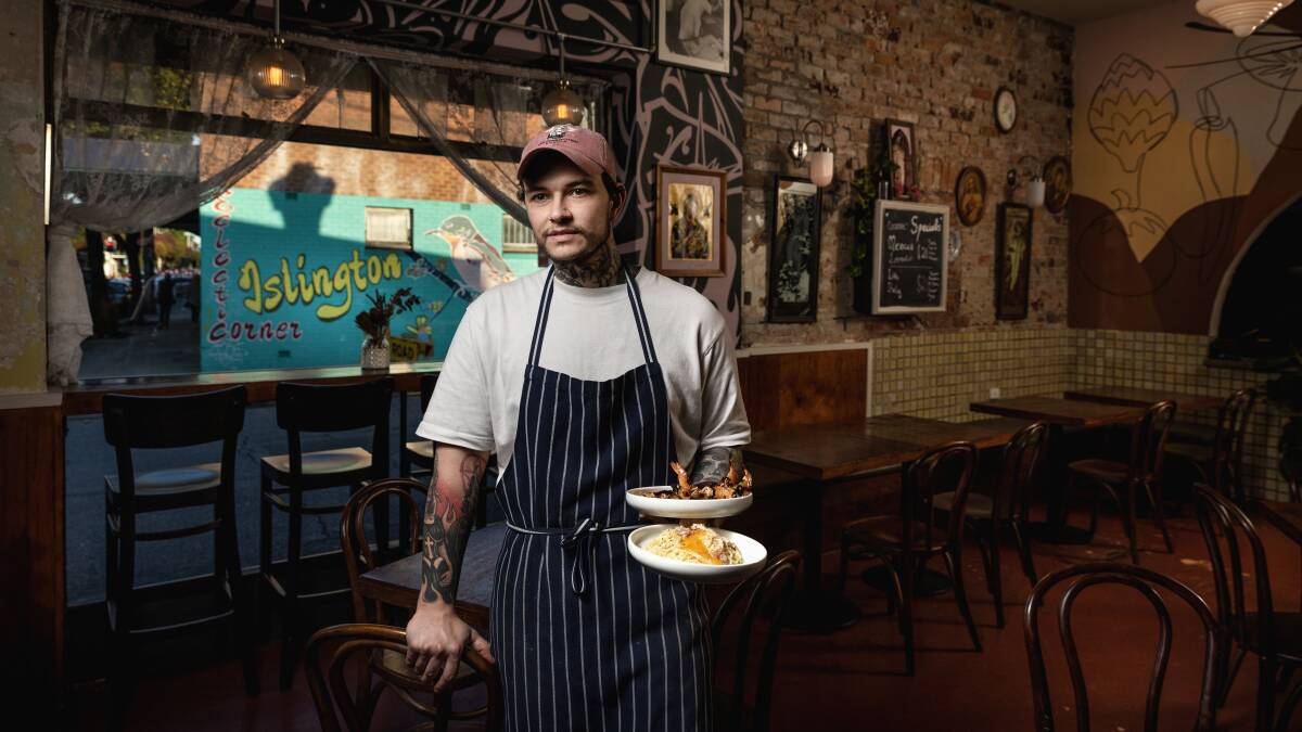 Chef and part-owner of Pino's Restaurant in Islington Dion Pophristoff has stopped serving a vegan-only menu this week in hopes of increasing business. He's holding King Prawns with nduja butter and lime and spaghetti carbonara with guanciale, pecorino, egg yolk and black pepper. Picture by Marina Neil