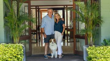 Andrew and Nickey Blades, with their dog Bear, at the front door of The Homestead at Sweetacres Hunter Valley. 
