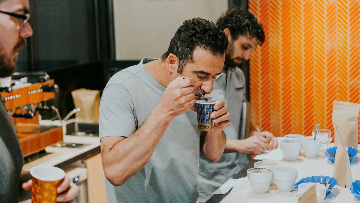 TASTE-MAKER: Peaberrys' Adrian Rigon demonstrating cupping. Picture: Bronte Godden/Lazy Bones Photography