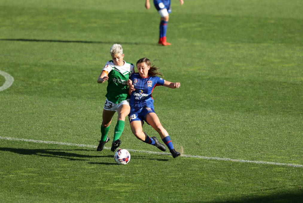 Clare Wheeler fights for the ball against Michelle Heyman in 2017 while playing for the Jets. Picture by Jonathan Carroll