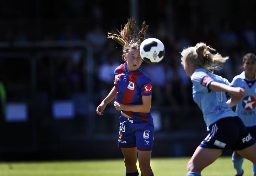 Clare Wheeler in action during her first season with the Newcastle Jets in 2014. Picture by Marina Neil