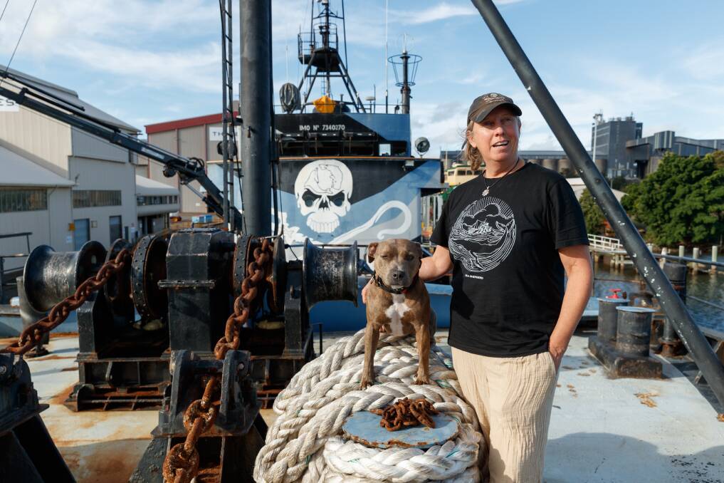 Kerrie Goodall, owner of MV Steve Irwin, with her dog Addie aboard the ship in Newcastle Harbour. Picture by Max Mason-Hubers