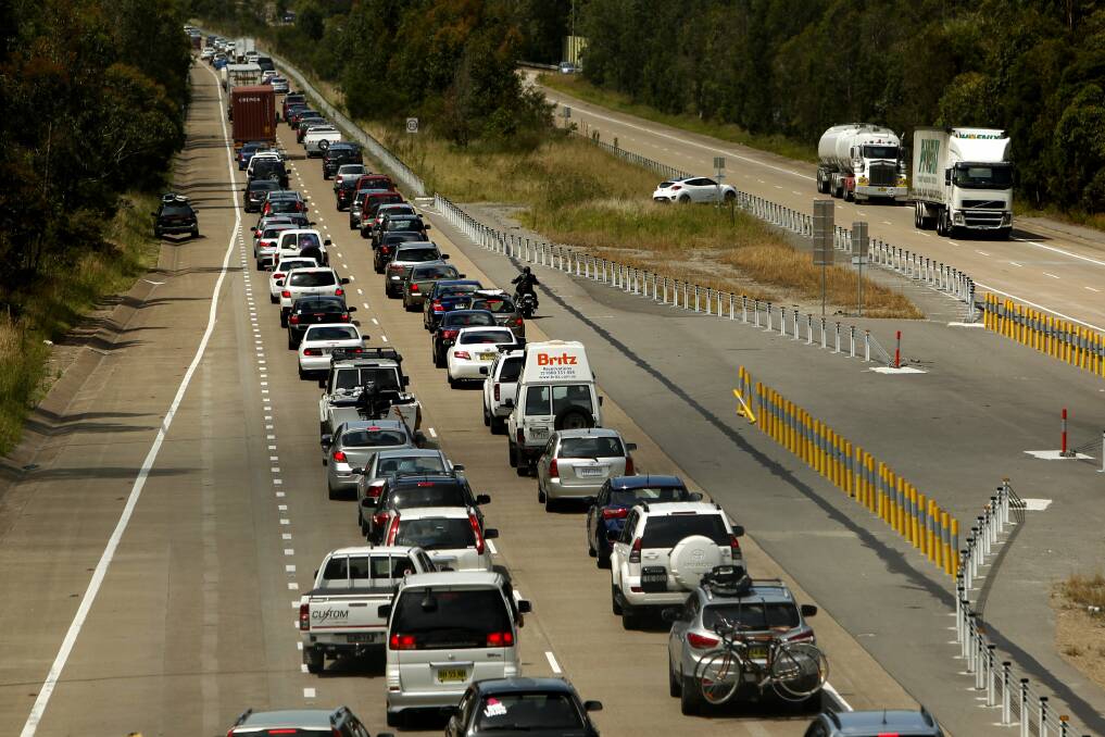 GRIDLOCKED: Solutions for the every-increasing congestion on the M1 between Sydney and Newcastle have been embraced then abandoned by successive governments. Improving current rail services would be a start. Picture: Jonathon Carroll