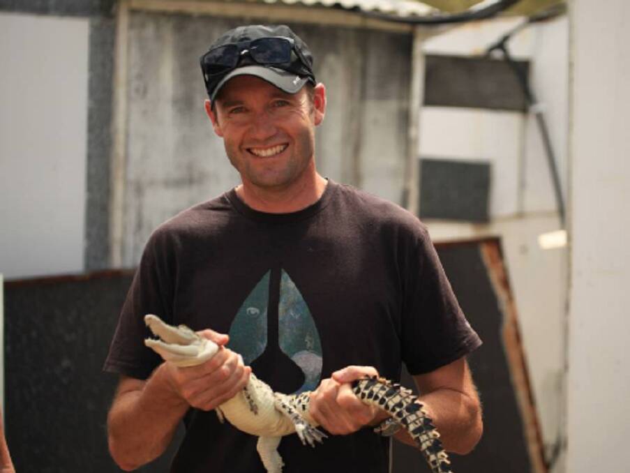 Professor Brett Nixon with a saltwater croc.  