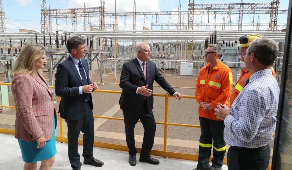 BIG GUNS: Prime Minister Scott Morrison, centre, talks with Tomago Aluminium workers at the switchyard supplying power to the smelter, in January this year. With him is Energy Minister Angus Taylor and Senator Hollie Hughes. Picture: Tomago Aluminium