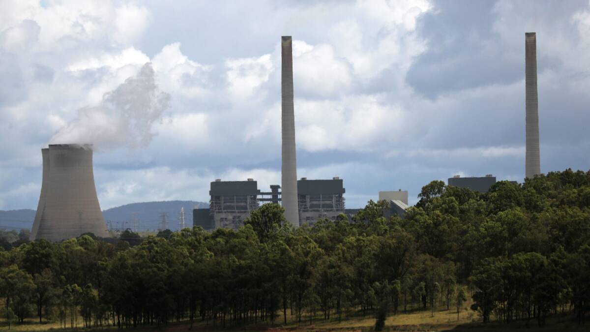 Steam rises from the distinctive cooling towers of AGL's Bayswater power station.