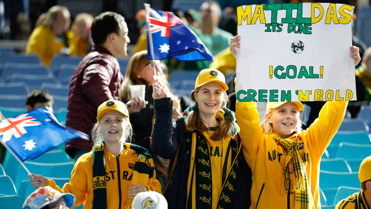 A group of Aussie fans show their support for the Matildas at Stadium Australia on Wednesday night. Picture by Adam McLean