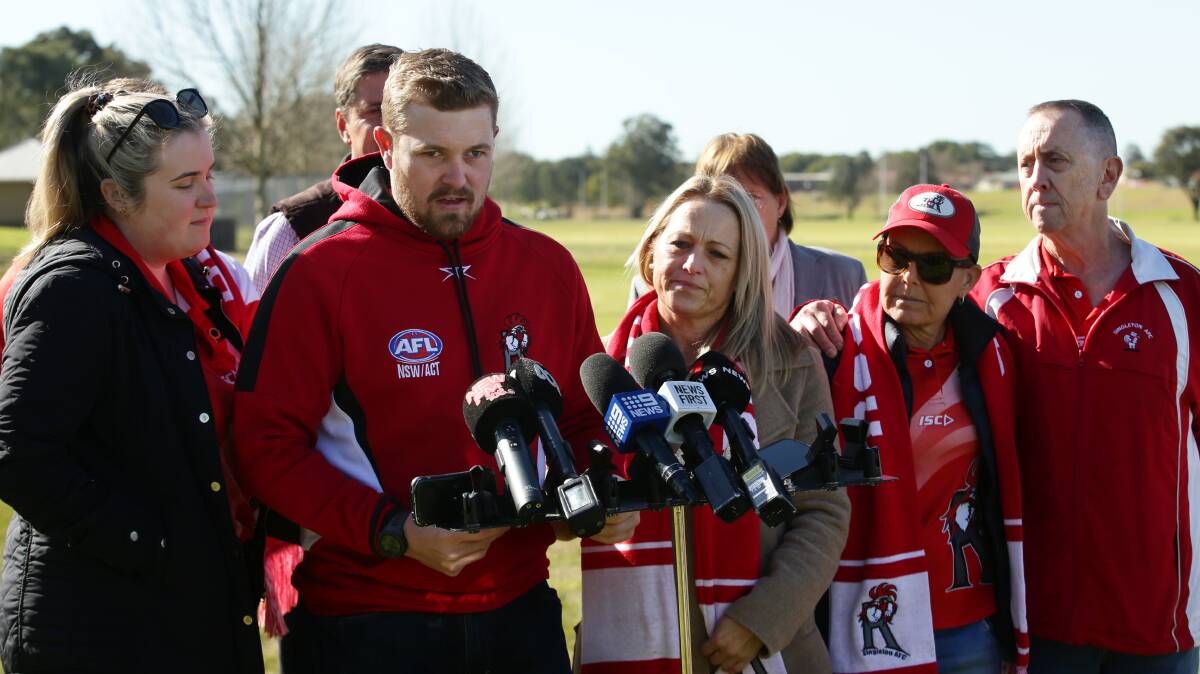 Roosters president Dylan Hixon addresses the media on Monday supported by club members. Picture by Simone De Peak