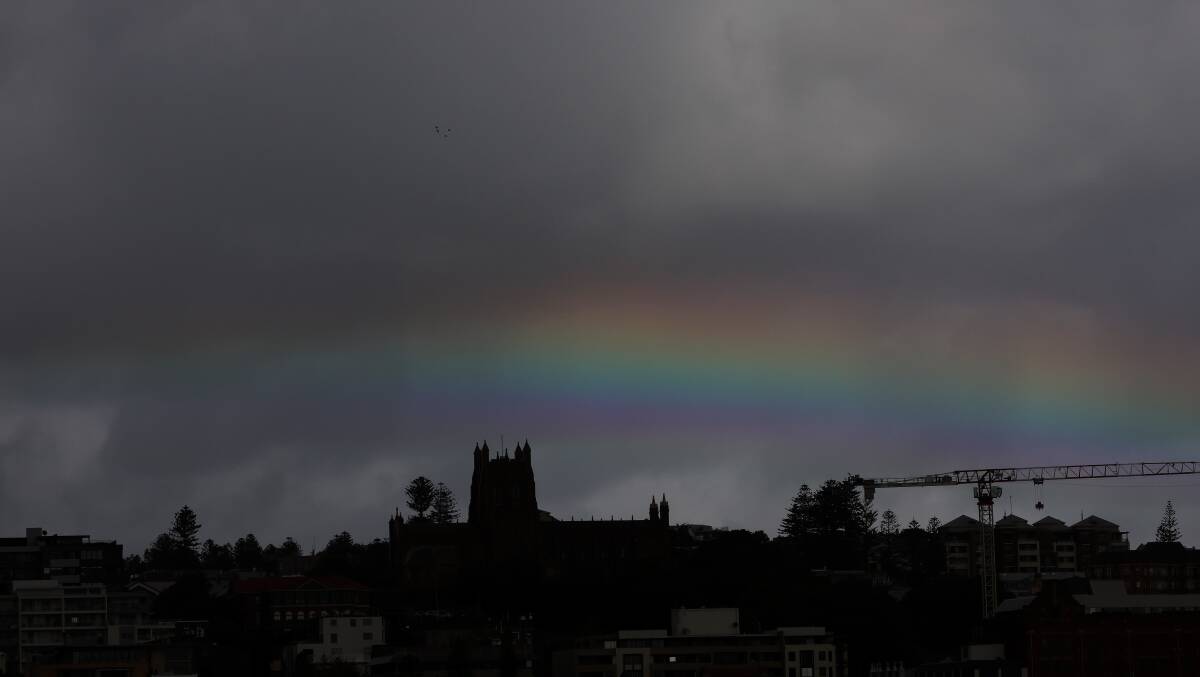 An unusual rainbow appears over Newcastle after torrential rain falls. Picture by Peter Lorimer