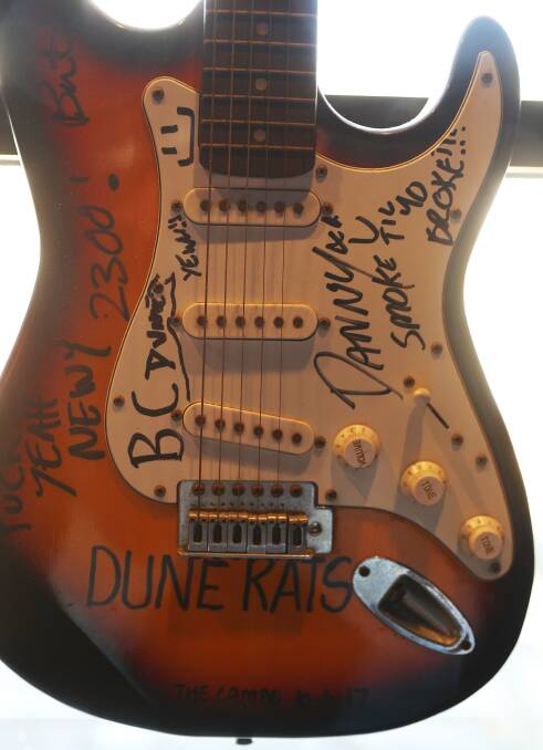 A guitar signed by the Dune Rats on the top floor of the new-look King Street Hotel. Picture by Peter Lorimer