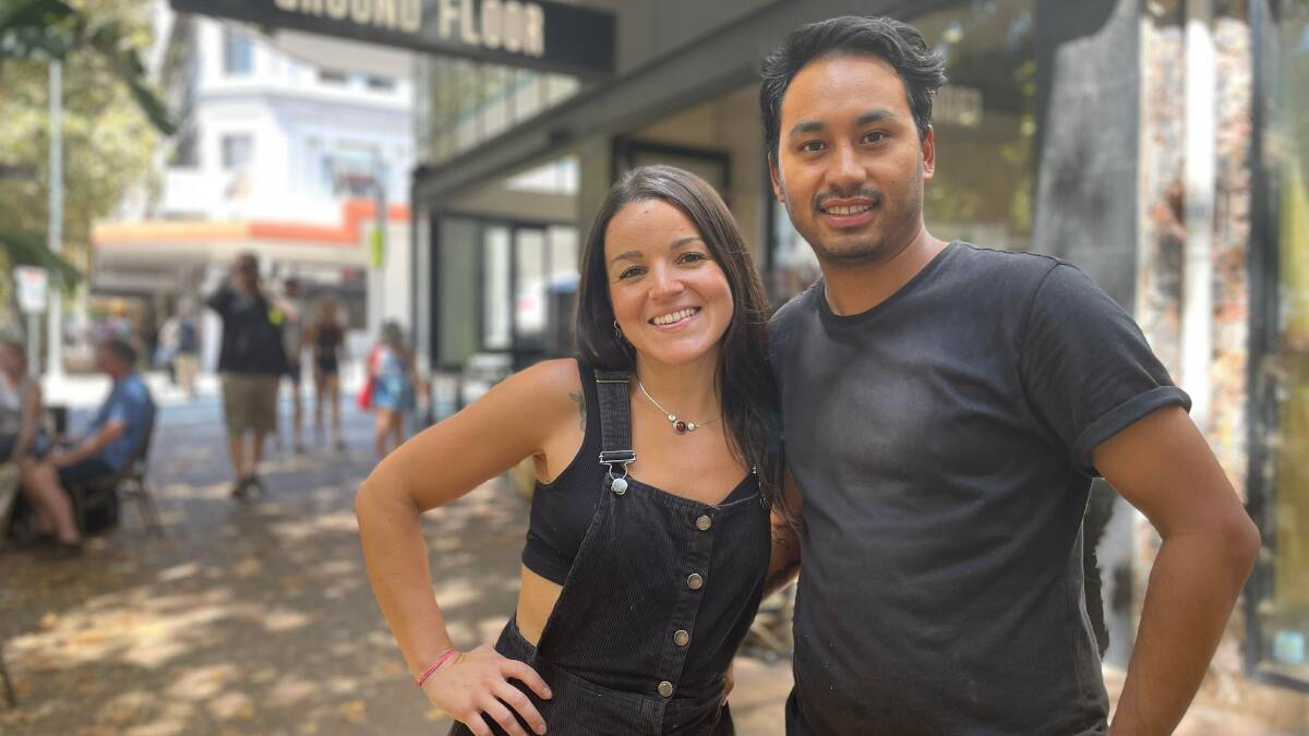 Nattali Souza manager at Ground Floor, with Bivek Satr cafe supervisor. Both want the Newcastle 500 residned for the next five years. Picture: Jessica Brown