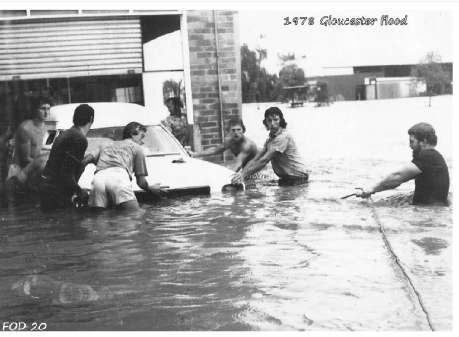 Historical image of the Hebblewhite brothers and their mates rescuing the bakery delivery van in the 1978 flood. 