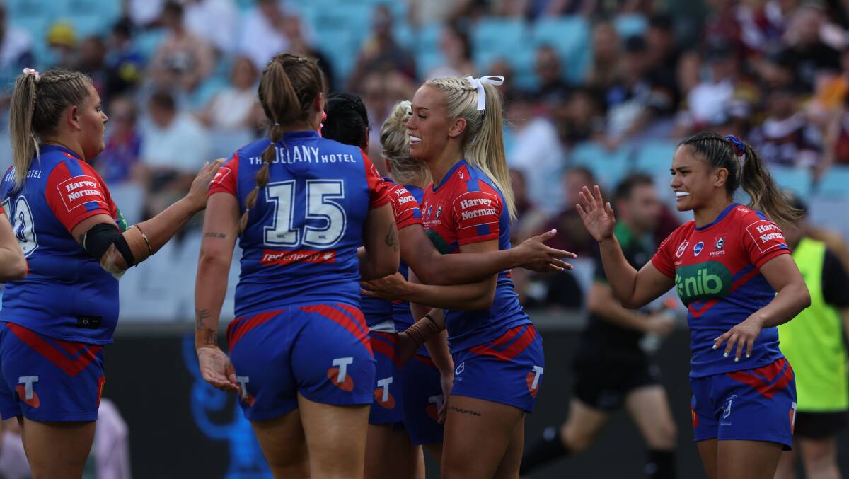 The Knights celebrate Jasmin Strange's opening try against Gold Coast. Picture by Marina Neil