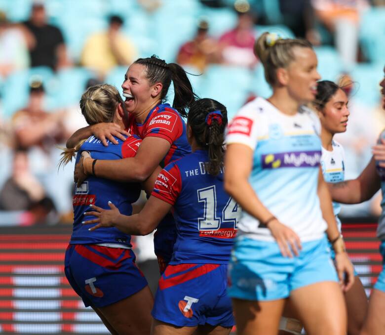 The Knights celebrate a Shanice Parker try. Pictures by Marina Neil