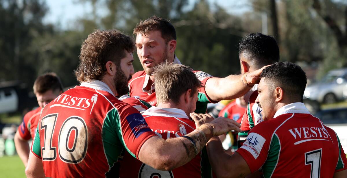 Wests celebrate a try in their win against Macquarie on Sunday. Picture by Peter Lorimer