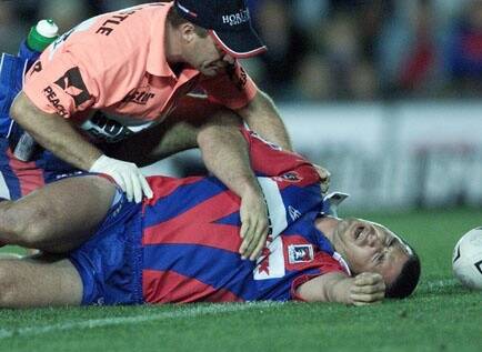 A knee in the back ended Andrew Johns' season in 2002. Picture by Darren Pateman