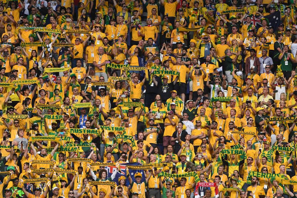TRUE COLOURS: Socceroos fans have travelled in their thousands to Russia for the World Cup. Imagine if the best Australians played for the same English Premier League club. Picture: AP