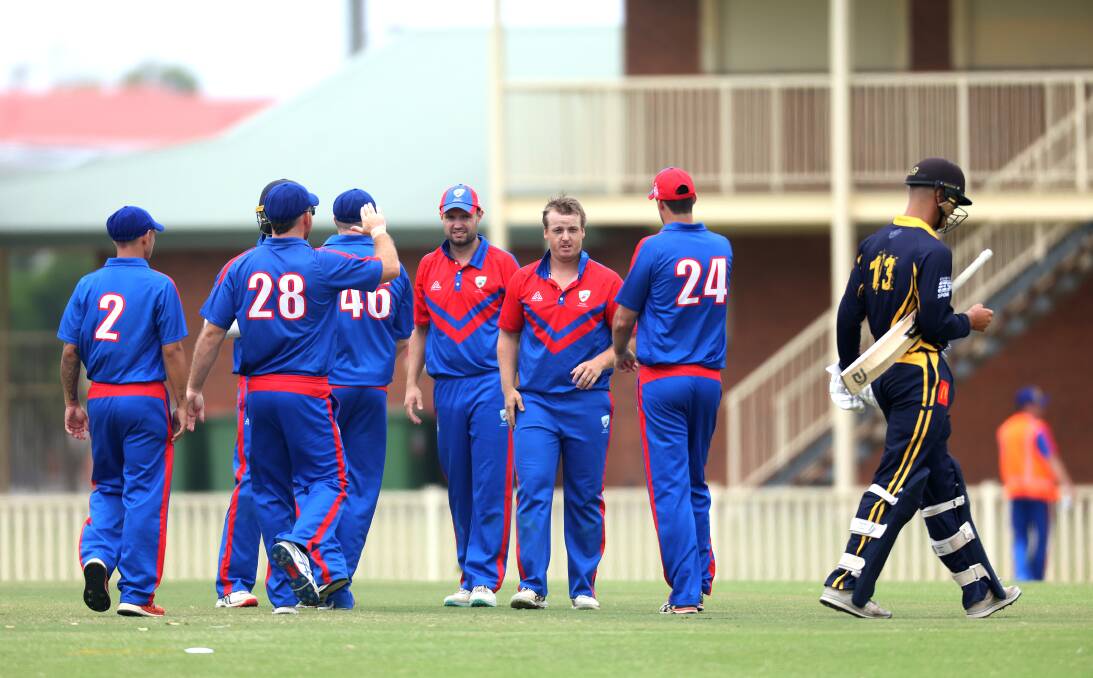 Newcastle celebrate an Aaron Bills wicket against Central Coast. Picture by Peter Lorimer