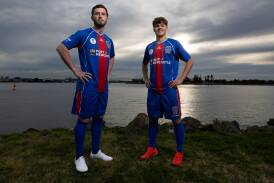 Thomas Aquilina and Alex Nunes model Newcastle's new Australia Cup kit. Picture by Jonathan Carroll