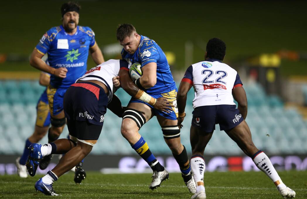 ON THE CHARGE: Aberdeen-raised lock Angus Lee-Warner carries the ball into the Rebels defence in the Force's 25-20 defeat at Leichhardt Oval in July. Picture: Getty Images