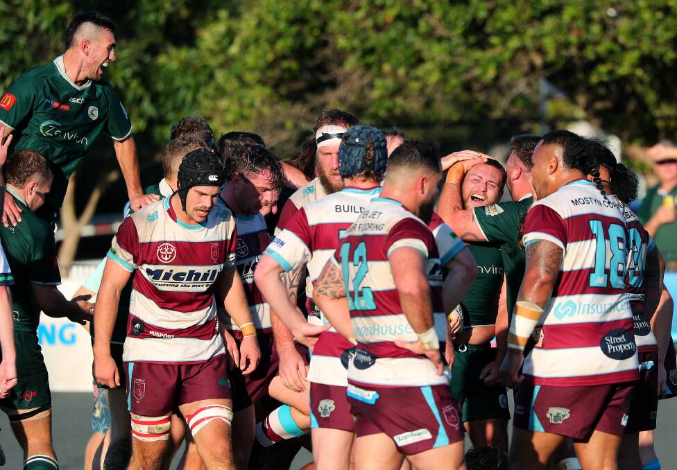 Merewether celebrates after hooker Brad Lauder crossed for a try in the 42-5 win over University at Townson Oval on Saturday. Picture by Peter Lorimer